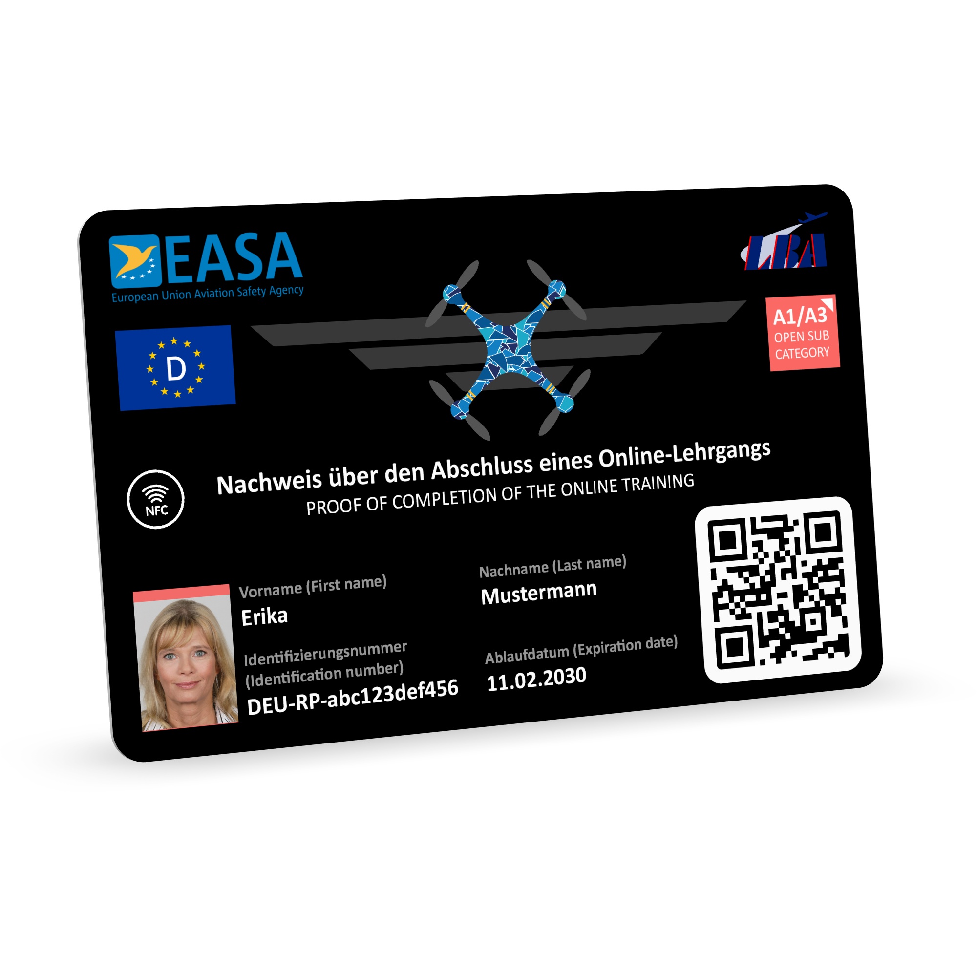 Single view of a deep black smart NFC EU drone license plastic card in standard ISO 7810 (ID-1) credit card format on a white background. Features a holder portrait in the lower left, EASA and LBA logos, an NFC icon, category badge A1/A3, and an enlarged…
