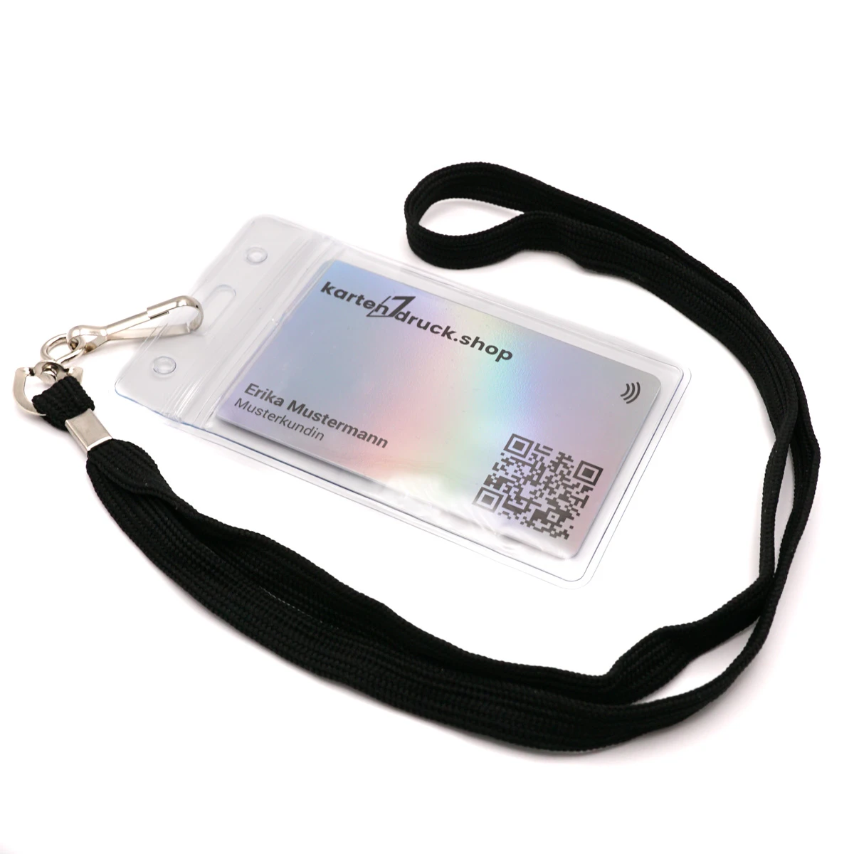 A black lanyard is attached to a clear badge holder via a metal clip, lying on a white background. Inside the protective pouch is an iridescent sample ID card with text and a QR code.