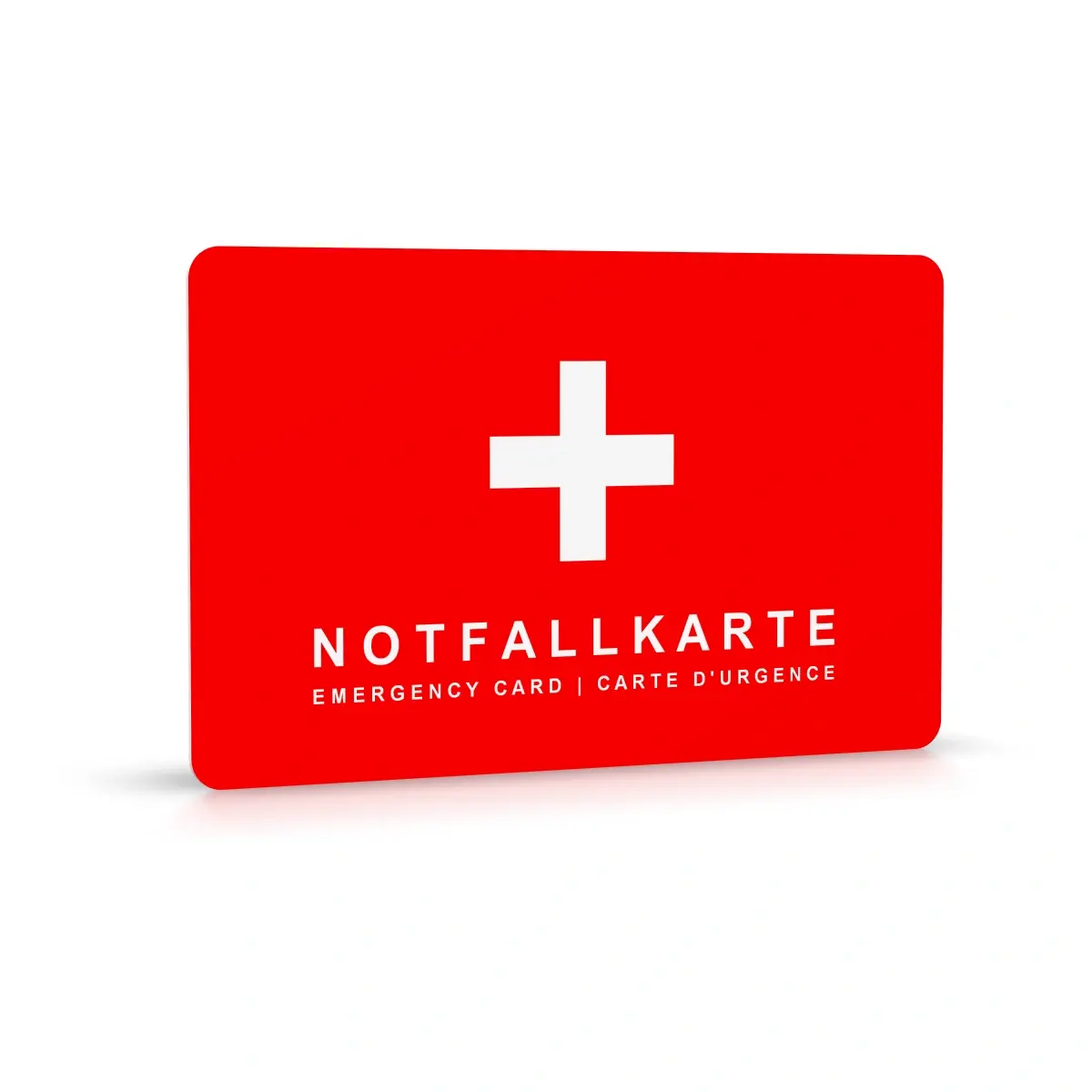 Aufrechtstehende, angewinkelte Darstellung der Notfallkarte (flächig rot mit Kreuz und Bezeichnung "Notfallkarte" in drei Sprachen